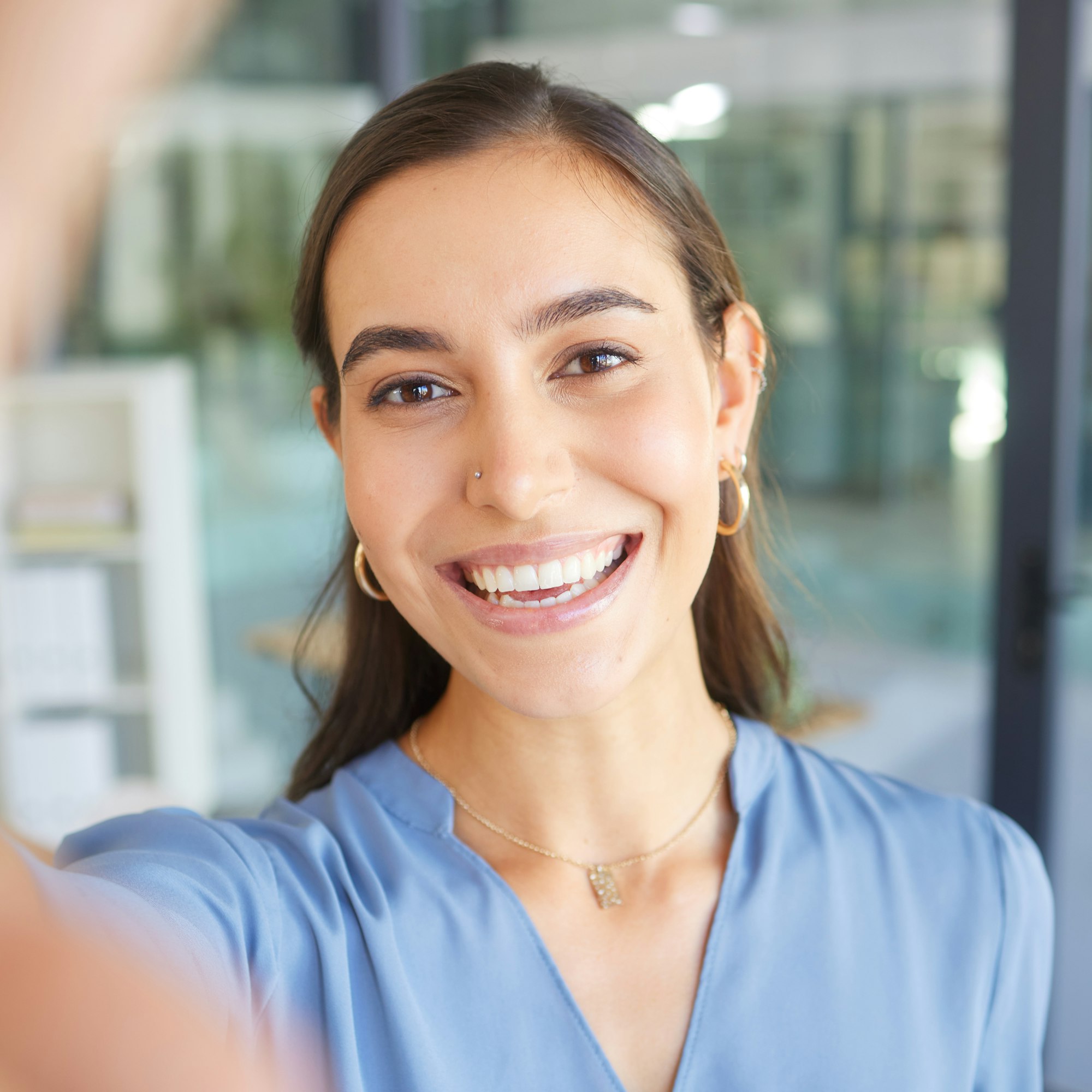 Happy, portrait or business woman taking a selfie in office building for a social media profile pic